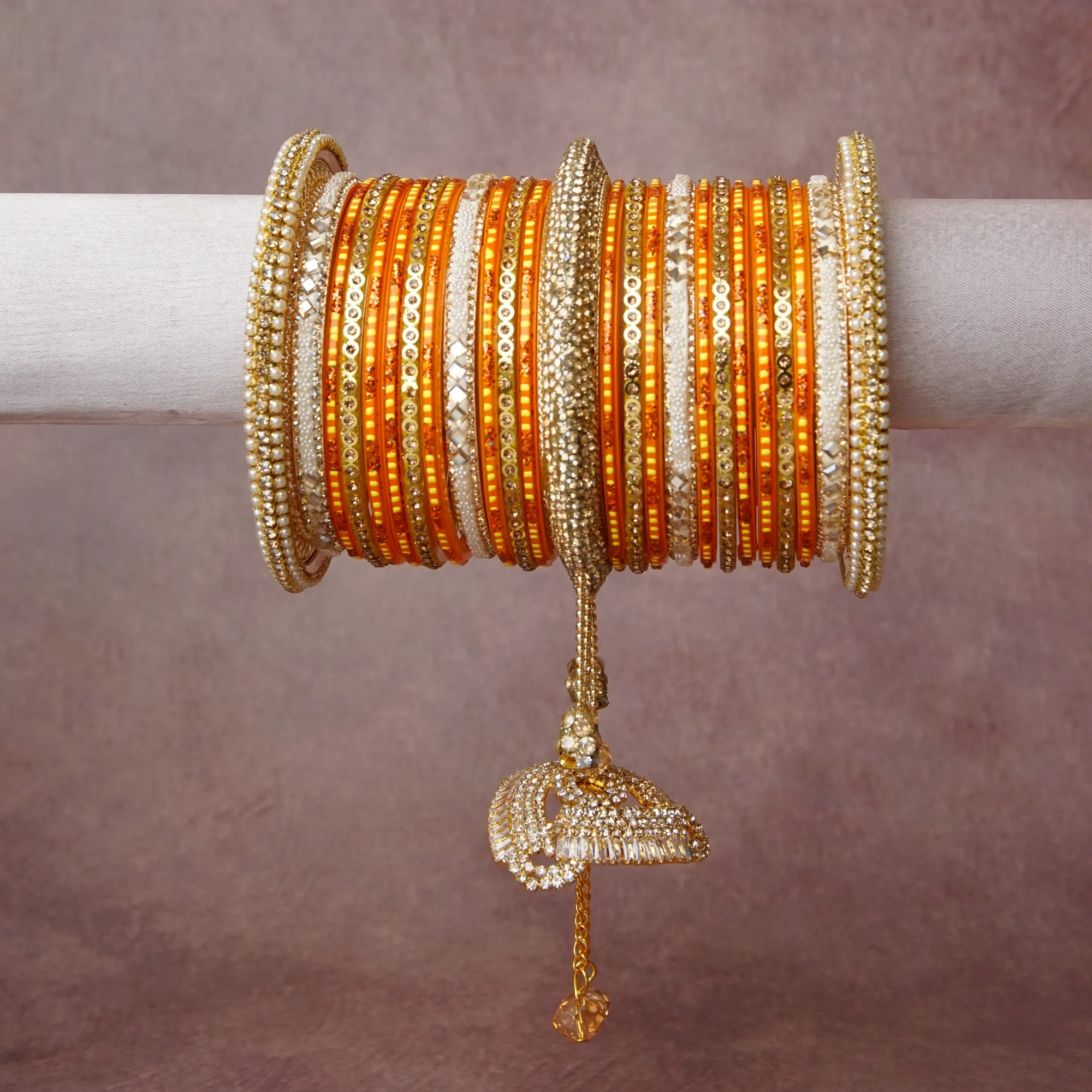 A grounding Orange forms the heart of the set, while touches of Gold, Cream, Clear add charm.

A thoughtful composition of Resin, Gold-toned Metal, Seed Beads, Faux Pearls, Rhinestones, Mirror Inlay, designed to feel complete without being heavy.
Each element layers seamlessly, creating a look that is refined, wearable and quietly striking.
